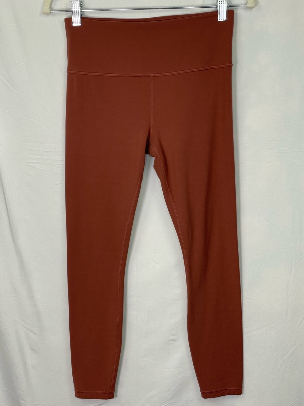 Athleta High-Waisted Rust Colored Leggings with Front Stash Pocket